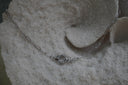 Silver-tone elongated-link necklace with a circular centre connector.