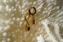 Alternate view: gold-tone hoop earrings with smooth rectangular padlock charms and curved lock tops.