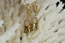 Alternate view: gold-tone hoop earrings with padlock-shaped drops, moon and star motifs, and clear round accents.