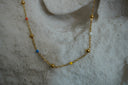 Alternate view: gold-tone chain necklace with multicoloured beads and reflective gold-tone spheres.