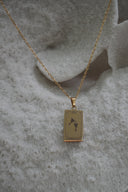 Alternate view: gold-tone necklace with a rectangular Temperance pendant showing two goblets and XIV lettering.