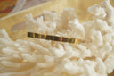 Alternate view: gold-tone open cuff with a smooth flat band and reflective surface.