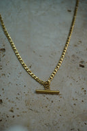 Alternate view: gold-tone necklace with alternating chain links and a smooth horizontal bar suspended at the centre.