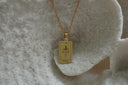 Alternate view: gold-tone necklace with a rectangular Justice pendant, sword-and-scales illustration and XI lettering.