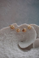Alternate view: gold-tone bracelet with a row of ridged fan-shell motifs.