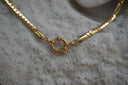 Alternate view: gold-tone necklace with flattened curb-style links and a round front clasp.
