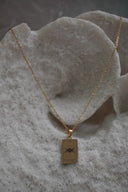 Alternate view: gold-tone necklace with a rectangular The High Priestess pendant, triple-moon illustration and II lettering.