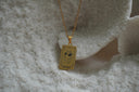 Alternate view: gold-tone necklace with a rectangular The Fool pendant showing a heart wearing sunglasses and 0 lettering.