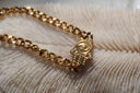 Alternate view: gold-tone chain bracelet with a hand-shaped centrepiece, eye motif and raised dot details.