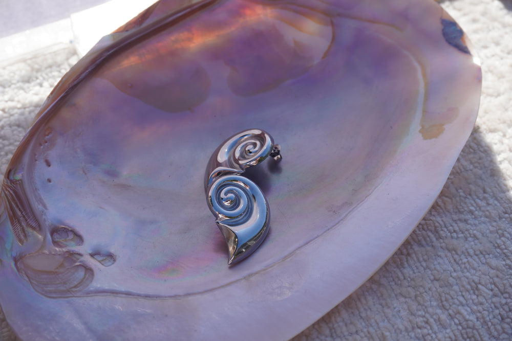 Alternate view: silver-tone sculptural spiral stud earrings tapering into curved pointed tails.
