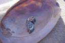 Alternate view: silver-tone sculptural spiral stud earrings tapering into curved pointed tails.