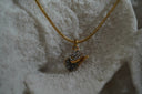 Alternate view: gold-tone necklace with a miniature western hat pendant covered in dark and bright details.