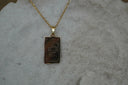 Alternate view: gold-tone necklace with a rectangular The Emperor pendant, crown-and-arrow illustration and IV lettering.