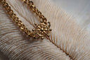 Alternate view: gold-tone chain bracelet with a ship-wheel centrepiece and rounded spoke tips.