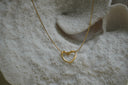 Alternate view: gold-tone necklace with an open heart-outline pendant.