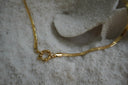 Alternate view: gold-tone flat-chain necklace with a round centre connector.