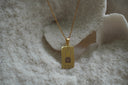 Alternate view: gold-tone necklace with a rectangular The Chariot pendant, framed canopy illustration and VII lettering.