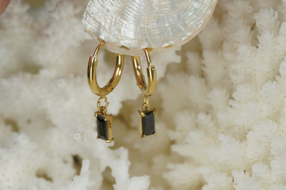 Alternate view: gold-tone hoop earrings with rectangular black faceted drops in corner-prong frames.
