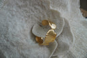 Alternate view: gold-tone open cuff formed from broad ridged fan-shell shapes.