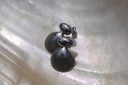Alternate view: silver-tone stud earrings with smooth oval tops and ridged fan-shell shapes.