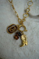 Alternate view: gold-tone open-link necklace with western hat and boot charms and dark brown beads.