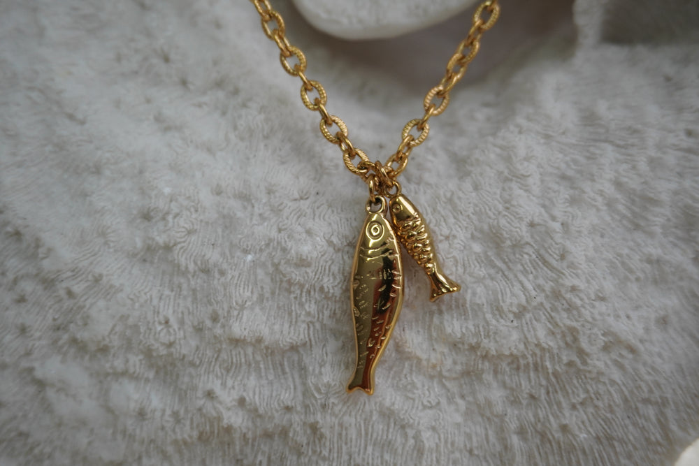 Alternate view: gold-tone link necklace with two hanging fish-shaped charms.